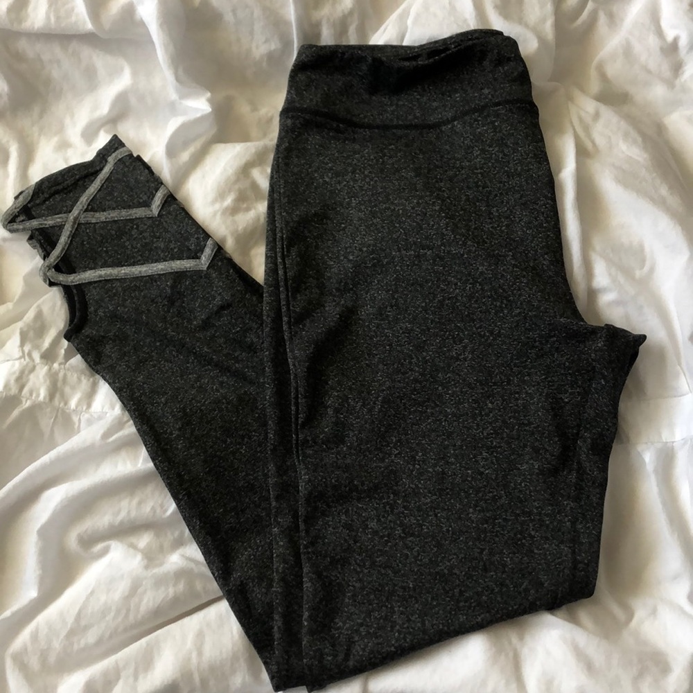 🛍 Dark grey yoga pants with cute ankle detailing.